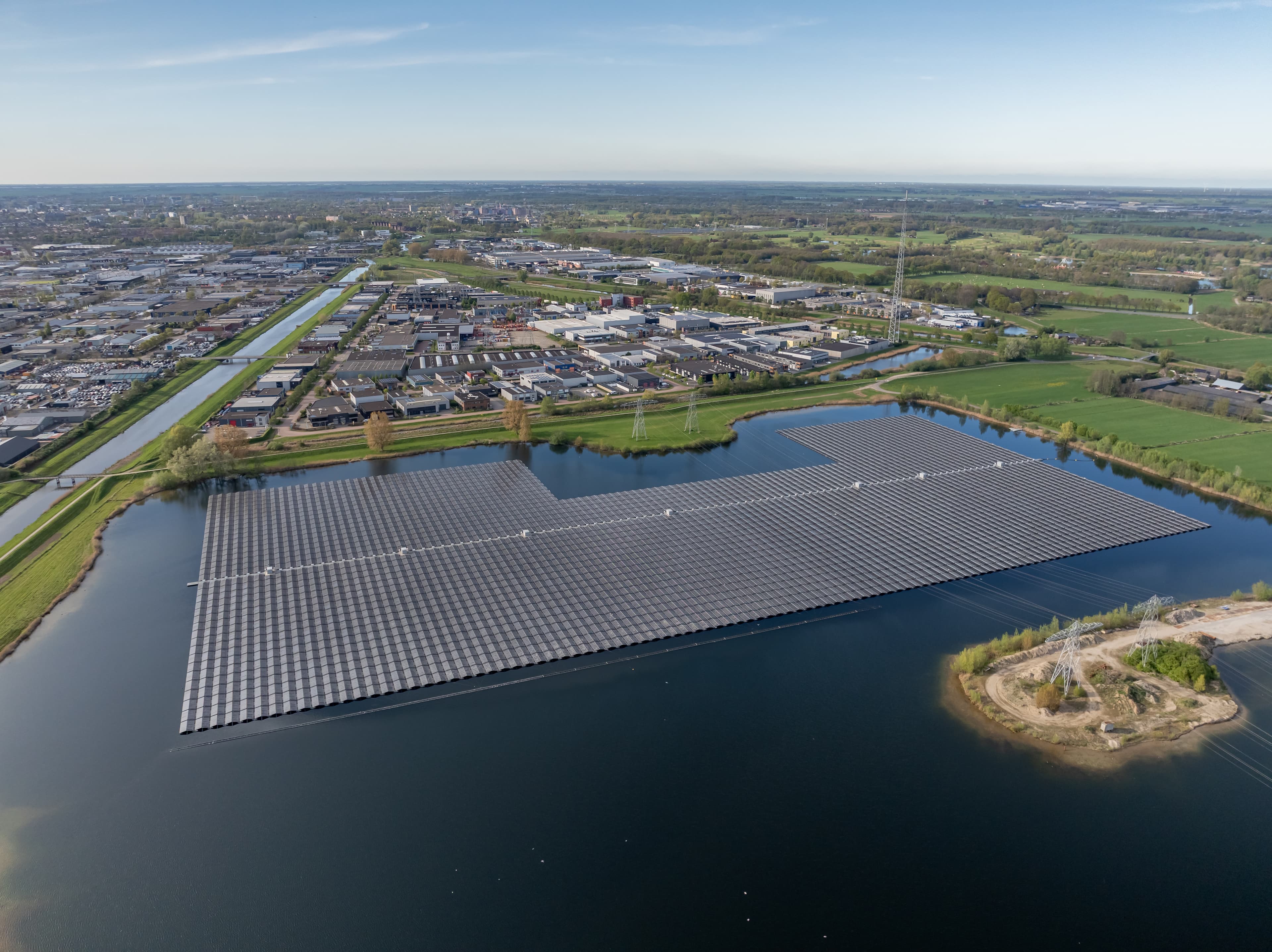 Comparison of solar panel installations on land versus water showing environmental benefits